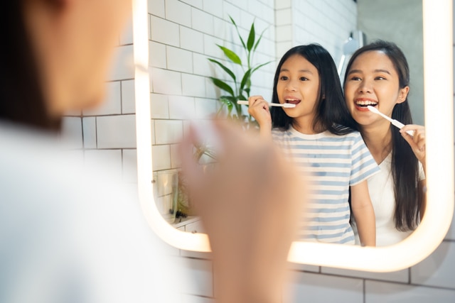 Young man taking tooth cavity treatment at home