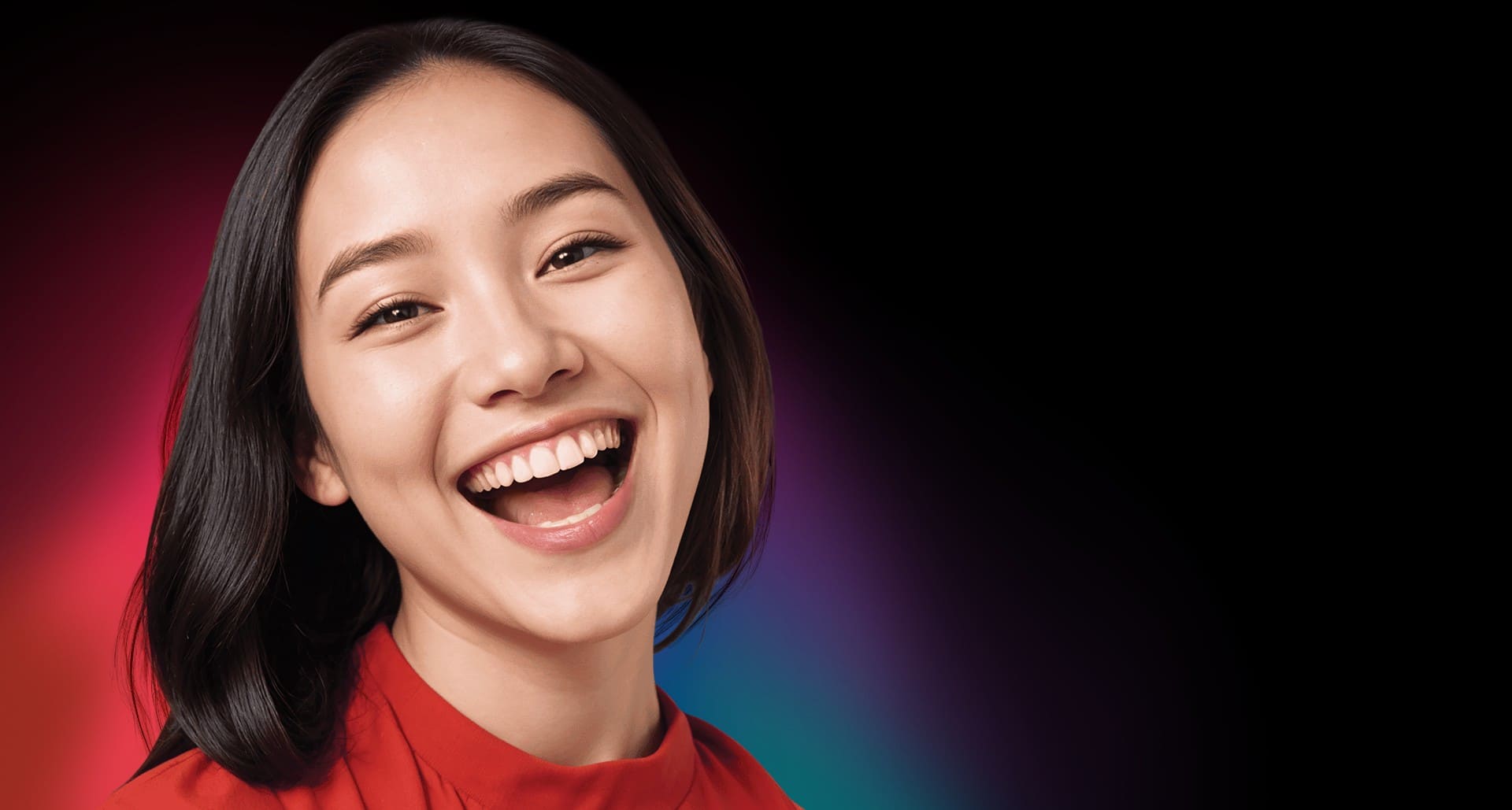 Woman smiling out loud; image used for introducing Colgate's best teeth whitening product Woman smiling out loud; image used for introducing Colgate's best teeth whitening product